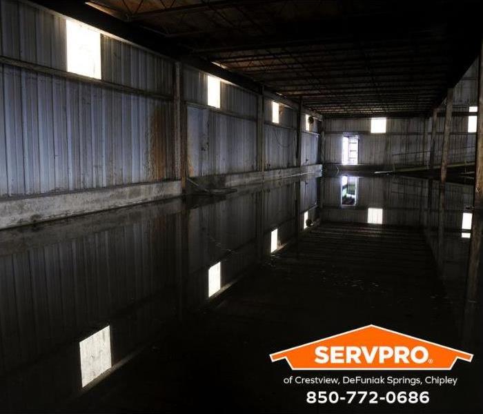 A flooded warehouse is shown.