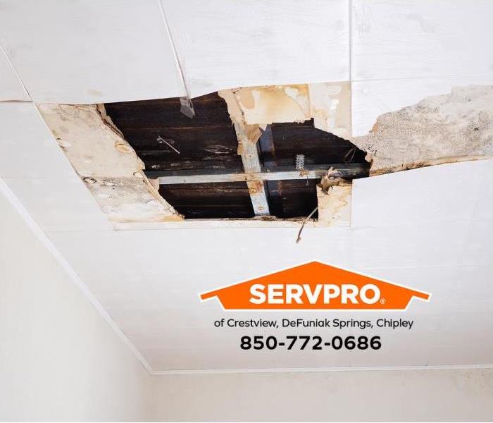A ceiling has water damage. 