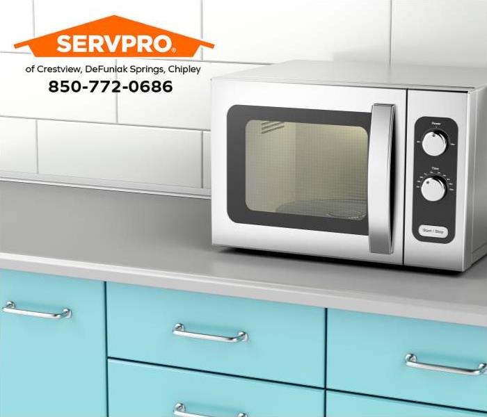 A microwave oven sits on a kitchen counter.