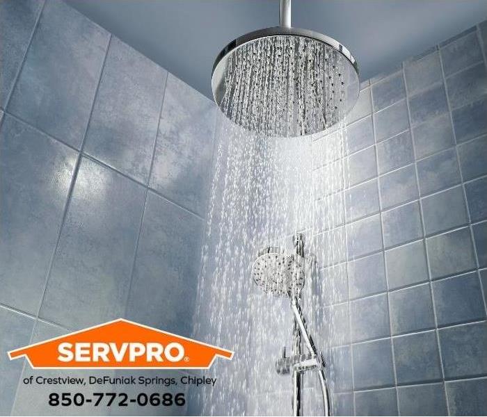 Running water from a showerhead is shown.
