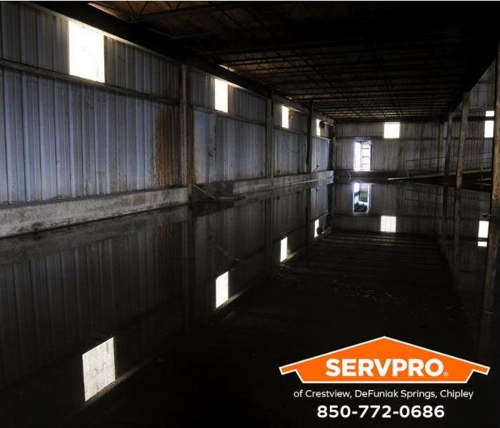 A flooded warehouse is shown.
